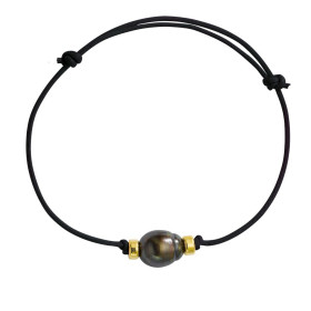 Black colored coton Tahitian pearl bracelet with gold ferrules