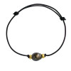 Black colored coton Tahitian pearl bracelet with gold ferrules