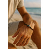 Man wearing the Tuamotu Coton bracelet with a Tahitian Pearl Hooped