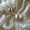 Bijou de Nombril Or Jaune 18k Perle d'Eau Douce Rose posée sur tissu