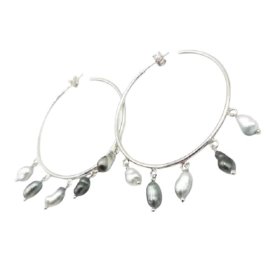 Pia sterling silver hoop earrings with five Tahitian keshi pearls on each hoop, front view on white background